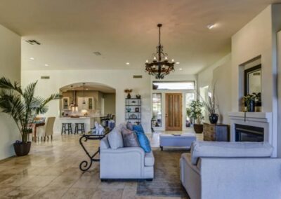 A large living room with a fireplace.