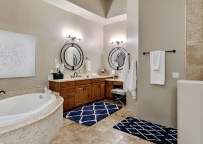 A bathroom with a large tub and sink.