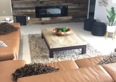 A living room with leather couches and a flat screen tv.