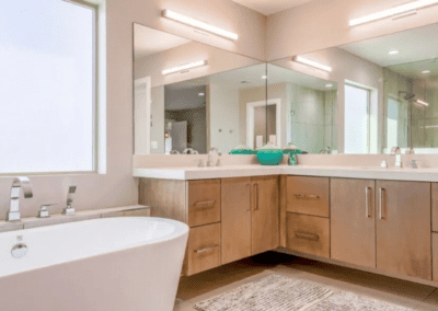 A bathroom with a large tub and sink.